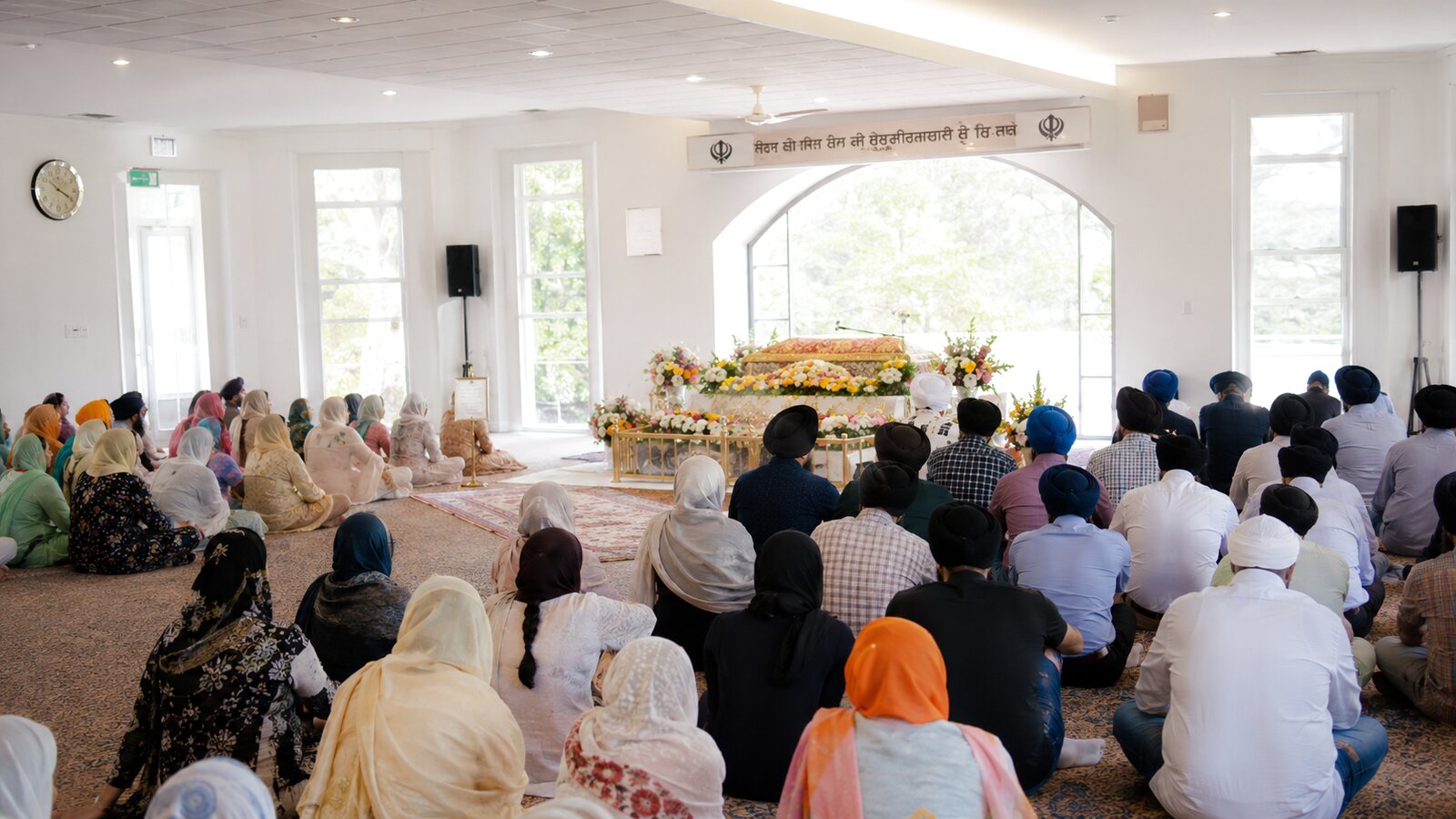 Sikh funerals in Australia: a gurdwara gathering with the congregation seated and heads covered
